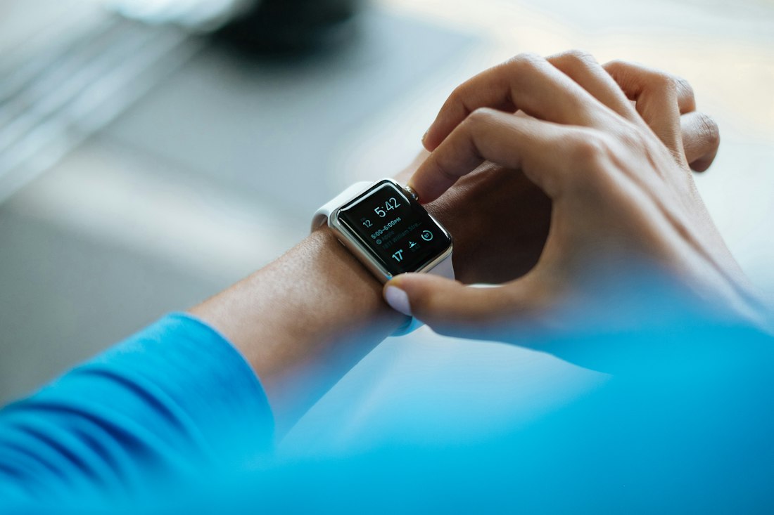 Athlete checking vitals on a smartwatch