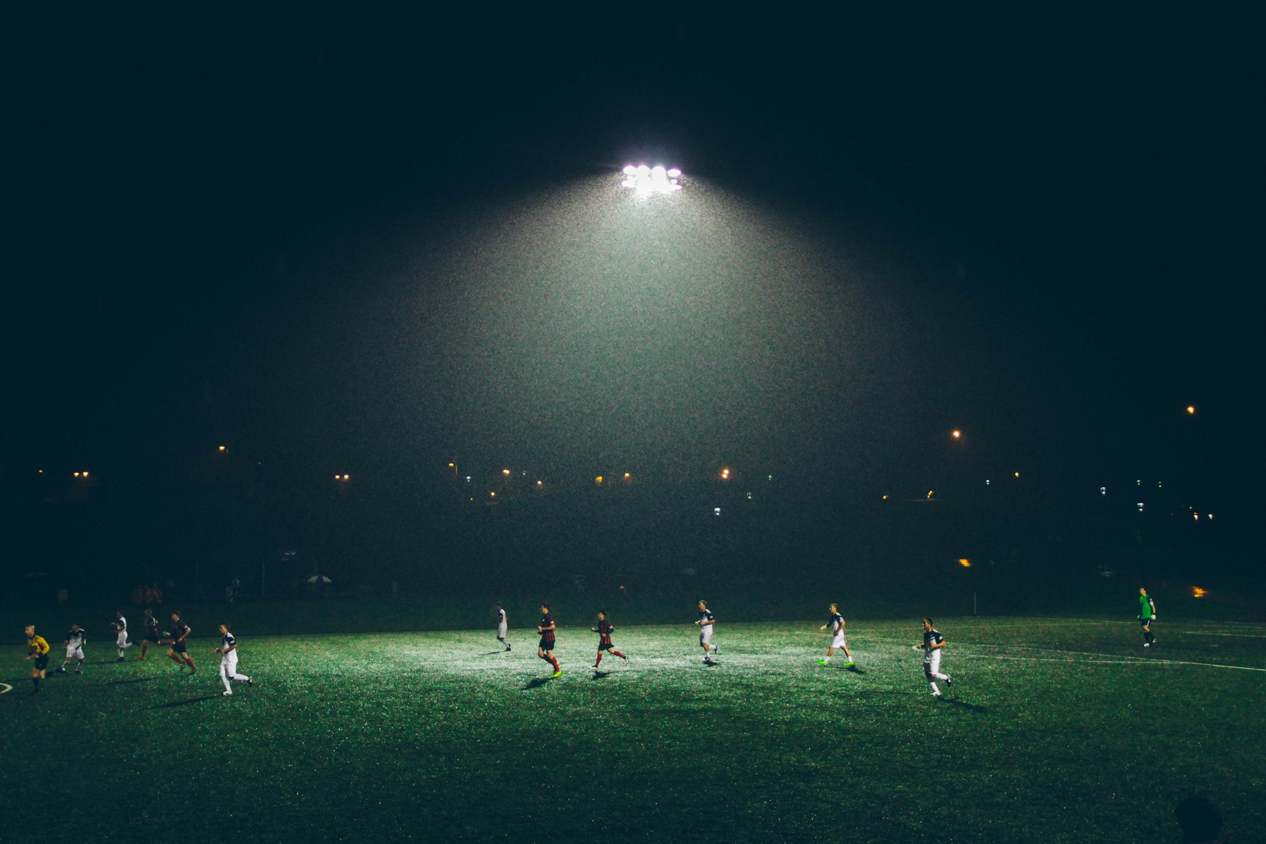 Floodlit playing field at night